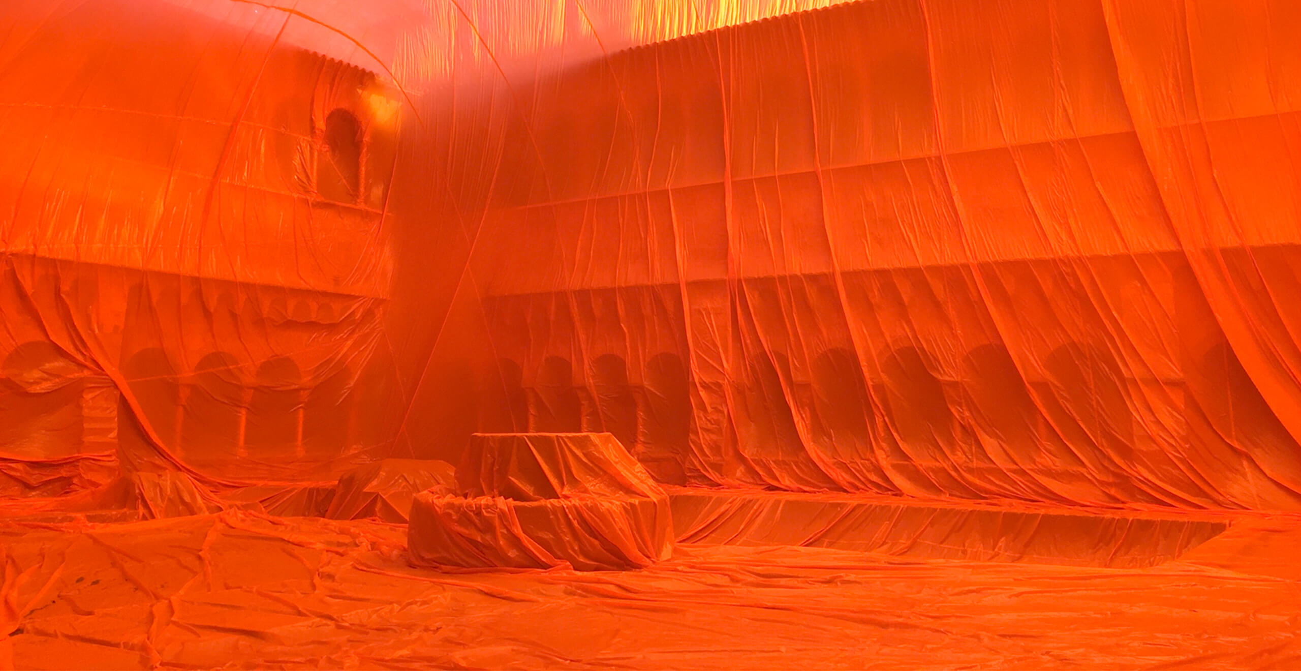 Large room entirely covered with an orange sheet - SEAT Created in Barcelona