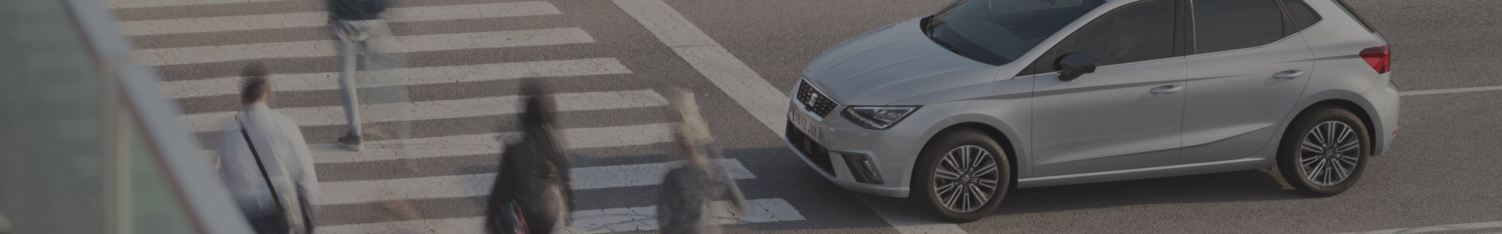 Highest operating profit in history – Header SEAT car stopped at street while people cross the road