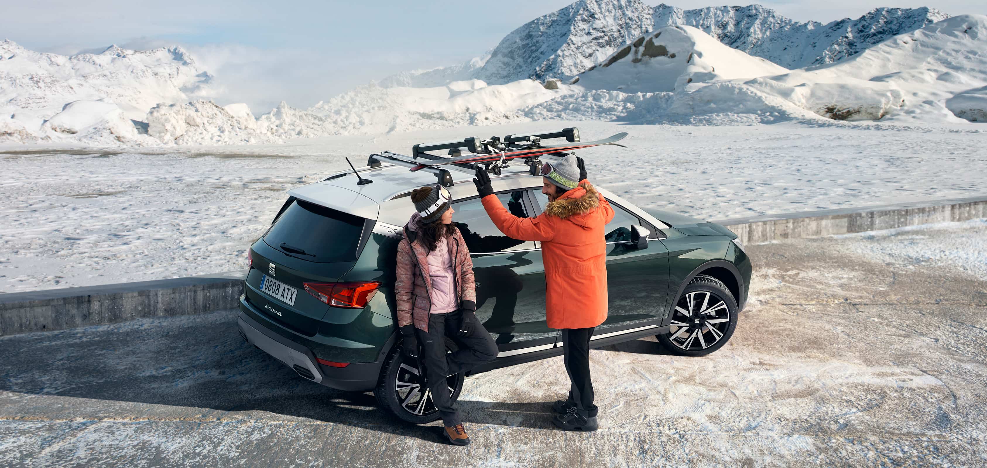 SEAT Arona dark camouflage with roof rack car